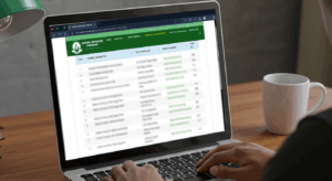 Student checking official NUC approved institutions list on laptop