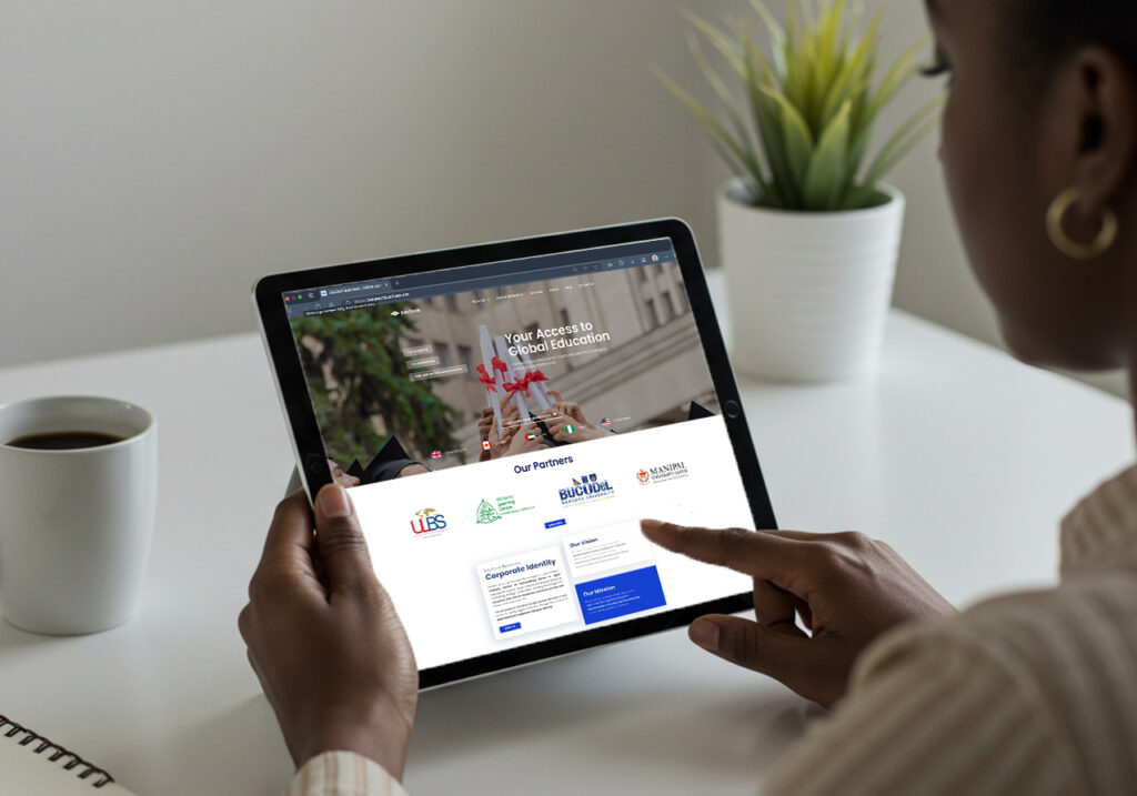 Woman using a tablet to browse Edutech business global university partnerships, showing how online degree recognition opens opportunities worldwide.