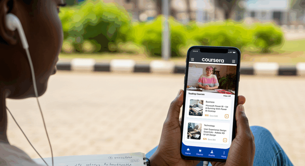 Student earning an accredited online degree on your phone through mobile learning in Nigeria